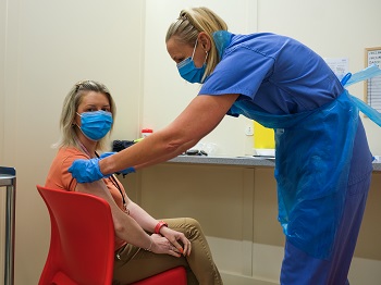 Health Visitor Suzanne Stevenson being vaccinated at the Chester Street 24.09.21