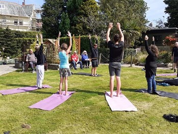 Poeple practising yoga on Brunswick Gardens fun day