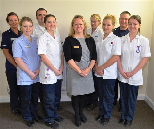 Chief Nurse with mentors and students
