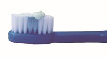 Tooth brush with smear of toothpaste