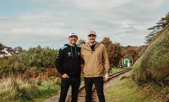 Dr Alex George and Peter Hickman walking along the Heritage Trail on the Isle of Man