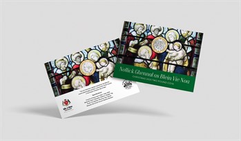 Picture showing the new coin featuring King Charles III within a card envelope saying Nollick Ghennal as Blein Vie Noa, Christmas 2023 the front of the coin features a Magi presenting gifts to the Christ-child, while back of the coin features the official effigy of King Charles III