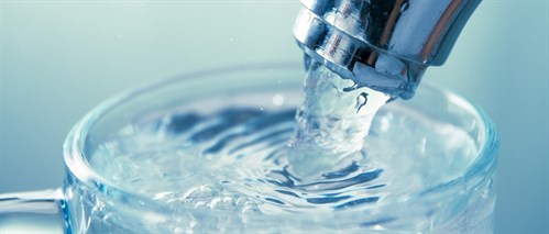 Image showing a glass under a running tap, filling with water