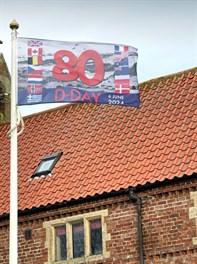 image depicting a waving flag commermorating the 80th anniversary of dday